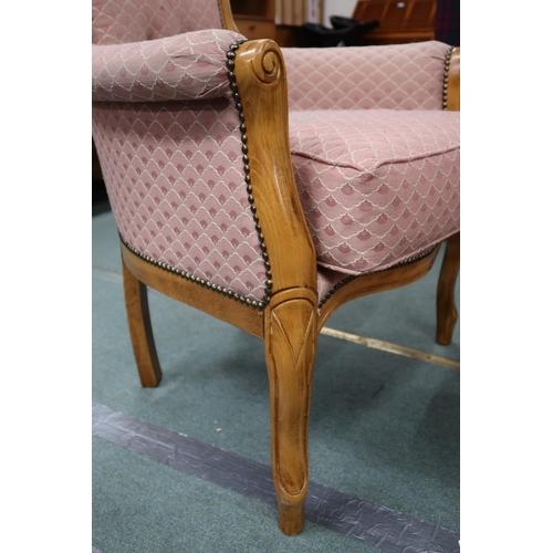 95 - A 20th century buttonback upholstered armchair and an upholstered footstool (2)