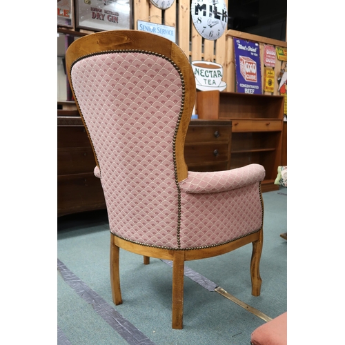 95 - A 20th century buttonback upholstered armchair and an upholstered footstool (2)