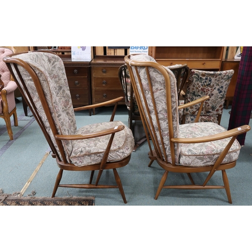 96 - A pair of mid 20th century Ercol elm and beech framed open armchairs with floral foliate upholstery,... 