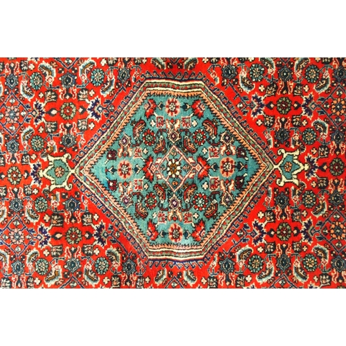 2131 - A RED GROUND BIJAR RUGwith light blue central medallion, dark blue spandrels and border, 161cm long ... 