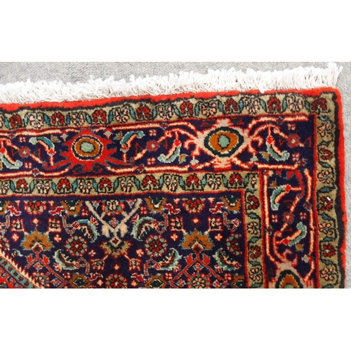 2131 - A RED GROUND BIJAR RUGwith light blue central medallion, dark blue spandrels and border, 161cm long ... 