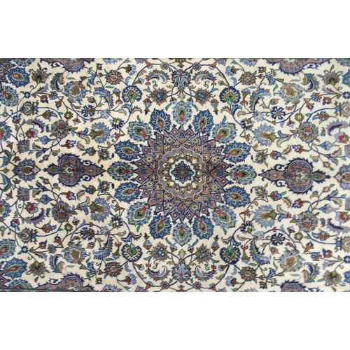 2134 - A CREAM GROUND MESHED RUGwith multicolour flower head central medallion, matching spandrels and flow... 