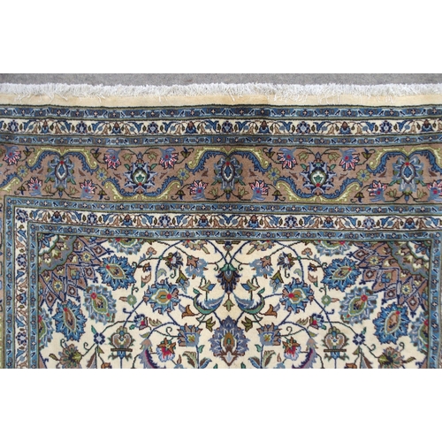 2134 - A CREAM GROUND MESHED RUGwith multicolour flower head central medallion, matching spandrels and flow... 