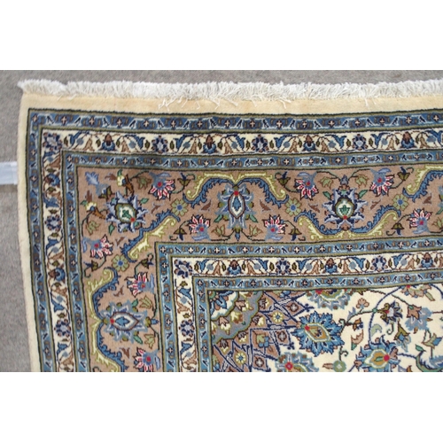 2134 - A CREAM GROUND MESHED RUGwith multicolour flower head central medallion, matching spandrels and flow... 