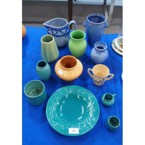 259 - A collection of Ashtead Pottery including a 1930's childs beaker with painted animal decoration, a m... 