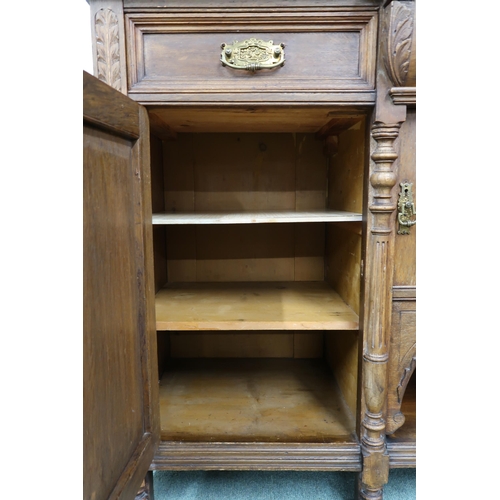 22 - A Victorian oak sideboard with three drawers over three cabinet doors, 98cm high x 150cm wide x 51cm... 