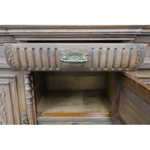 22 - A Victorian oak sideboard with three drawers over three cabinet doors, 98cm high x 150cm wide x 51cm... 