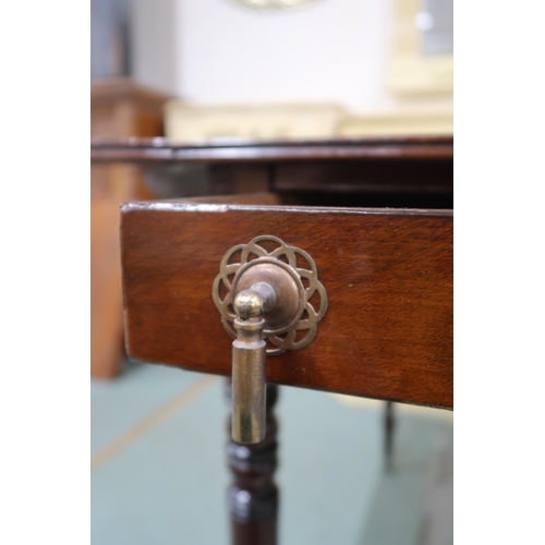 25 - A Victorian mahogany Pembroke table on turned supports terminating in brass casters, 70cm high x 100... 