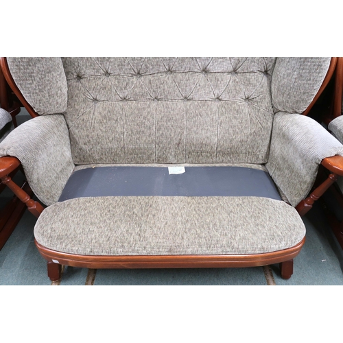 34 - A 20th century beech framed Ercol style four piece suite comprising two two seater sofas, 102cm high... 