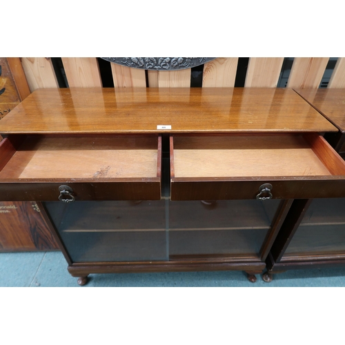 48 - A pair of 20th century stained teak bookcases with pair of drawers over glass sliding doors, 90cm hi... 