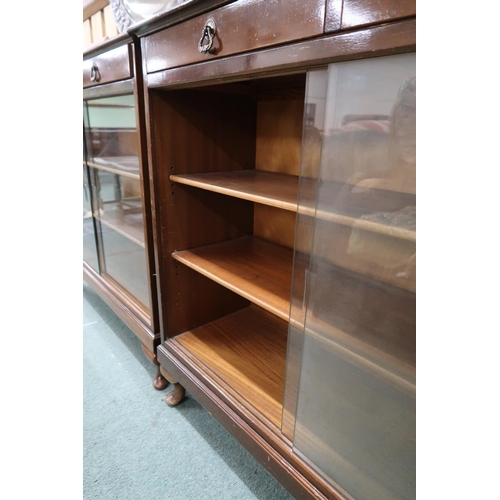 48 - A pair of 20th century stained teak bookcases with pair of drawers over glass sliding doors, 90cm hi... 