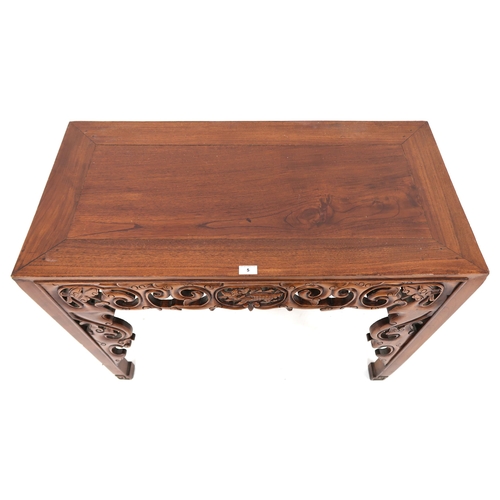 5 - A 20th century Oriental hardwood altar table with extensively carved pierced friezes over square sha... 