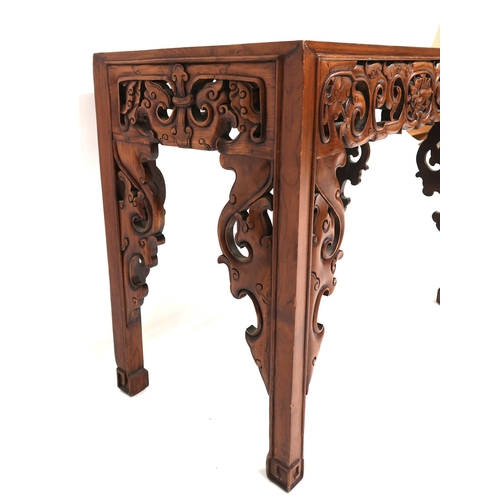 5 - A 20th century Oriental hardwood altar table with extensively carved pierced friezes over square sha... 