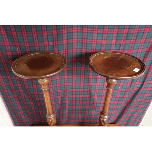 59 - A pair of 20th century mahogany torchiere stands on tripod bases, 92cm high x 31cm diameter (2)