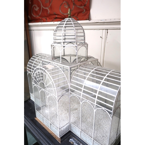 A late Victorian glass terrarium in the form of a green house on ebonised  base with stretchered turn