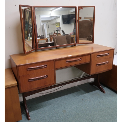 63 - A mid 20th century teak G Plan Fresco dressing mirror with three mirrors over single central drawer ... 