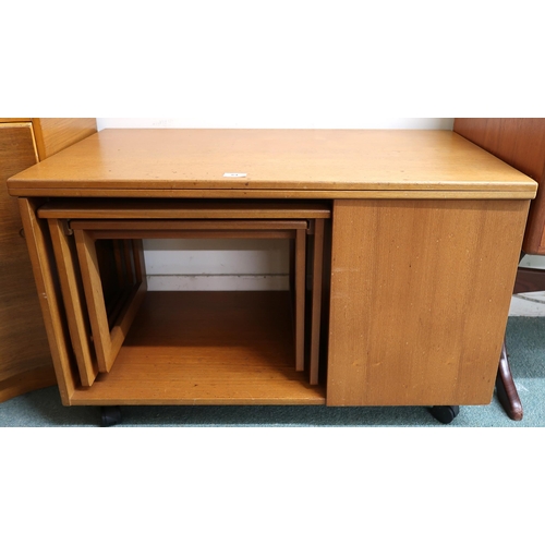 64 - A mid 20th century teak McIntosh Tristor fold over top coffee table with integrated nest of two tabl... 