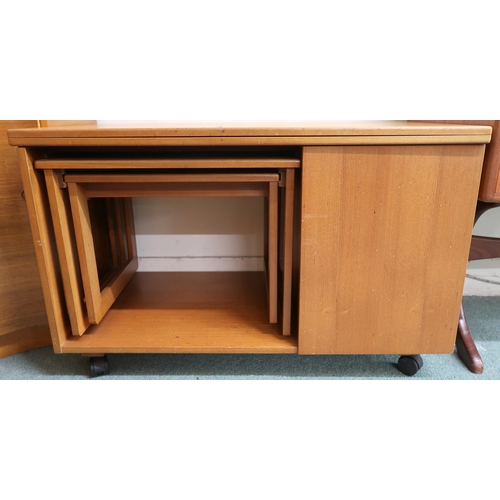 64 - A mid 20th century teak McIntosh Tristor fold over top coffee table with integrated nest of two tabl... 