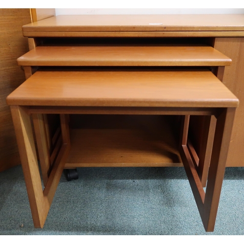 64 - A mid 20th century teak McIntosh Tristor fold over top coffee table with integrated nest of two tabl... 