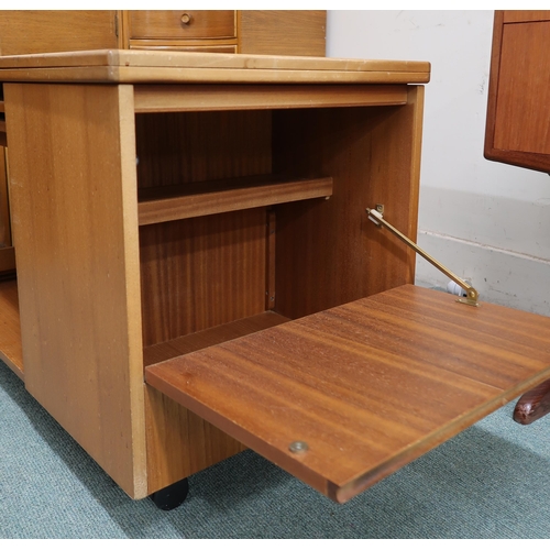 64 - A mid 20th century teak McIntosh Tristor fold over top coffee table with integrated nest of two tabl... 