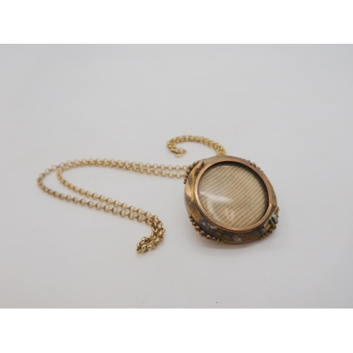 502 - A yellow metal Etruscan revival locket back brooch (pin lacking) and a 9ct gold belcher chain, lengt... 