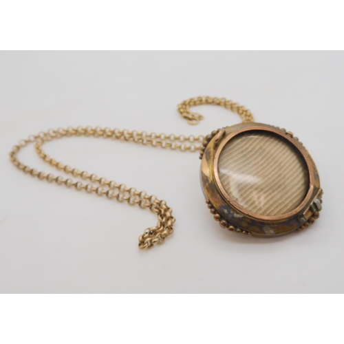 502 - A yellow metal Etruscan revival locket back brooch (pin lacking) and a 9ct gold belcher chain, lengt... 