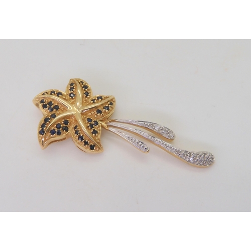 504 - A 14k gold sapphire and diamond accent starfish pendant, weight 5.3gms