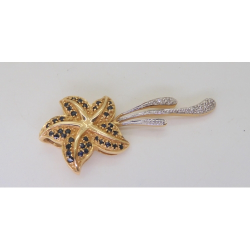 504 - A 14k gold sapphire and diamond accent starfish pendant, weight 5.3gms