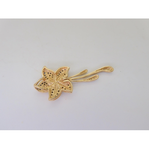 504 - A 14k gold sapphire and diamond accent starfish pendant, weight 5.3gms