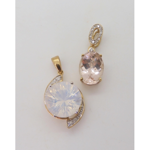 512 - A 9ct gold milky quartz and diamond accent pendant, length 3.1cm, together with a 9ct pale blue gem ... 