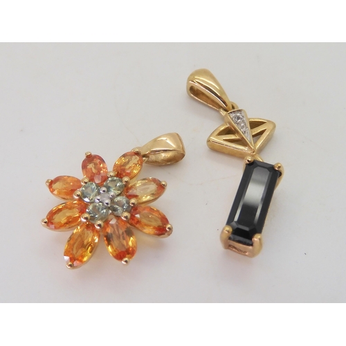 524 - A 9ct gold bi colour orange gem (possibly Andalusite) green gem and diamond accent flower pendant, t... 