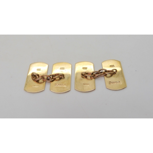 527 - A boxed set of cufflinks hallmarked Chester 1949, and four 9ct shirt studs with floral engraving, we... 