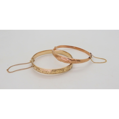 544 - A 9ct gold bangle (af) 6.2gms, together with a 1/15 9ct metal core bangle