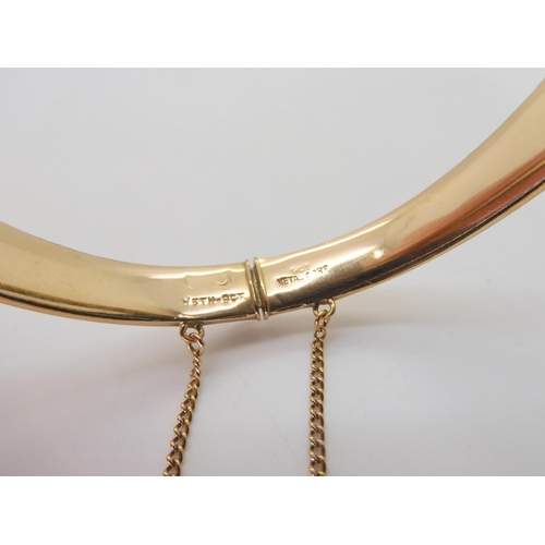 544 - A 9ct gold bangle (af) 6.2gms, together with a 1/15 9ct metal core bangle