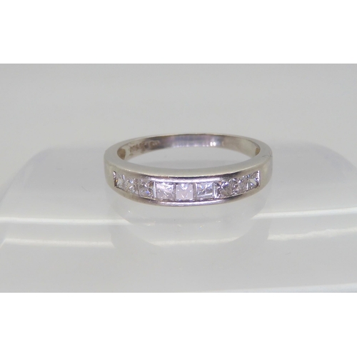 564 - A platinum half eternity ring set with estimated approx 0.50cts of princess cut diamonds, size N1/2,... 