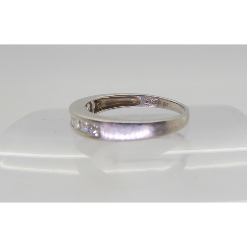 564 - A platinum half eternity ring set with estimated approx 0.50cts of princess cut diamonds, size N1/2,... 