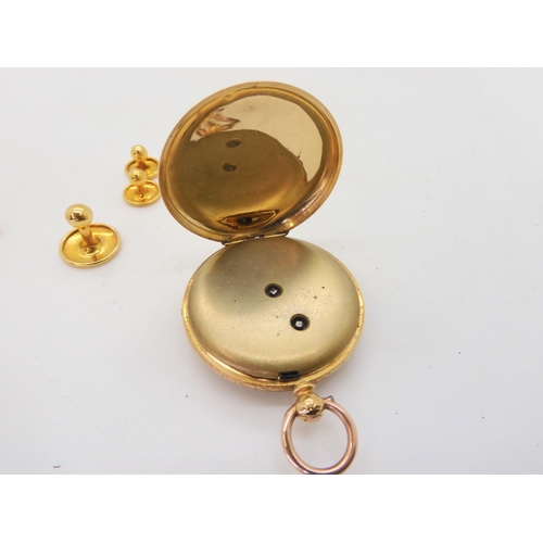 569 - An 18ct open face fob watch, with gold coloured dial diameter 3.6cm, weight including mechanism and ... 