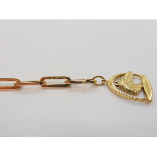 570 - A Dutch 14k gold long link bracelet, with an attached horse in stirrup charm, length 20.5cm, weight ... 