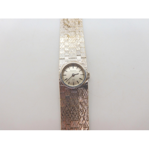 573 - A 9ct white gold ladies retro Bulova watch, hallmarked London 1966, length 16cm, weight 31.9gms, inc... 