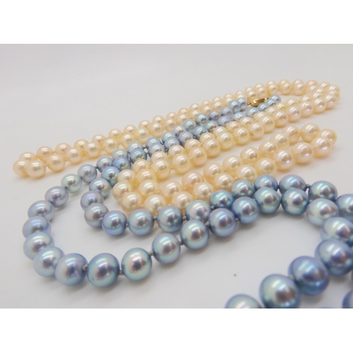 577 - A string of pale blue good quality pearls, each pearl approx 8.1mm with a yellow metal clasp, l... 