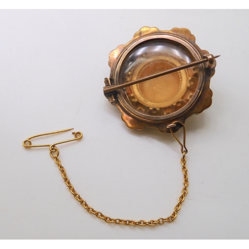 584 - A collection of 9ct gold and yellow metal items to include a miniature locket pendant painted with a... 