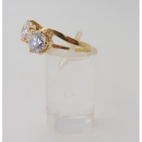 589 - A 14k gold twin cz ring, size O1/2, weight 4.8gms