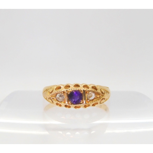 592 - An 18ct gold amethyst and rose cut diamond ring, hallmarked Chester 1918, size T1/2, weight 2.1gms