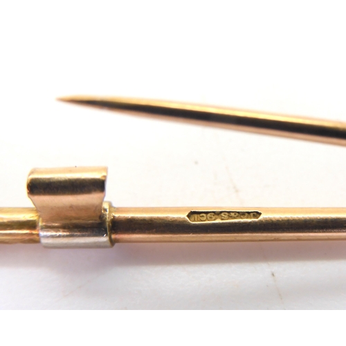 594 - A 9ct gold riding crop brooch made by Joseph Cook & Son, length 5.8cm, together  with a 9ct... 