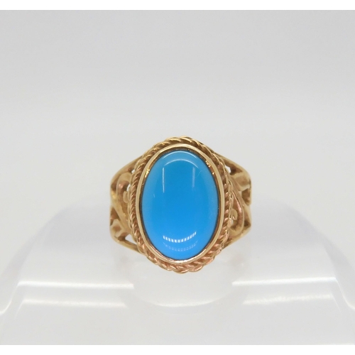 597 - A 9ct gold ring set with a large turquoise of approx 13.5mm  x 10mm, size P1/2, weight 7.7gms