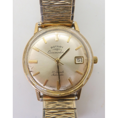 665 - A Swiss gold Rotary Commodore watch (af) weight including mechanism and strap 53.9gms, four silver b... 