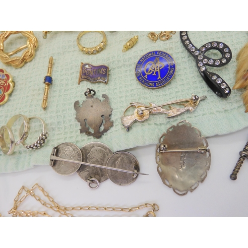 668 - A collection of vintage costume brooches, silver and white metal jewellery to include a Pontin's bro... 