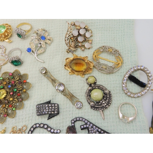 668 - A collection of vintage costume brooches, silver and white metal jewellery to include a Pontin's bro... 