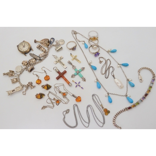 676 - A collection of silver and gemstone crosses, a silver charm bracelet with fifteen silver and white m... 