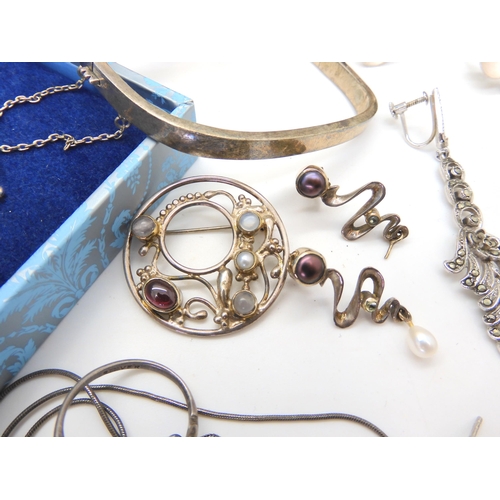 680 - A collection of silver and costume jewellery to include Mackintosh style items, silver bangles, desi... 